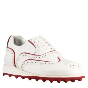 Scarpe golf fatte a mano in pelle colore bianco con dettagli colore rosso.